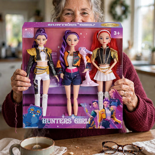 Grandmother holding the 2026 edition singing dolls box, three dolls in one box